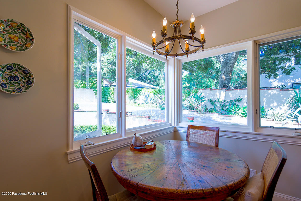 1987 Braeburn Road Altadena, CA 91001 - Photo 18 of 48 a dining room with furniture a chandelier and wooden floor