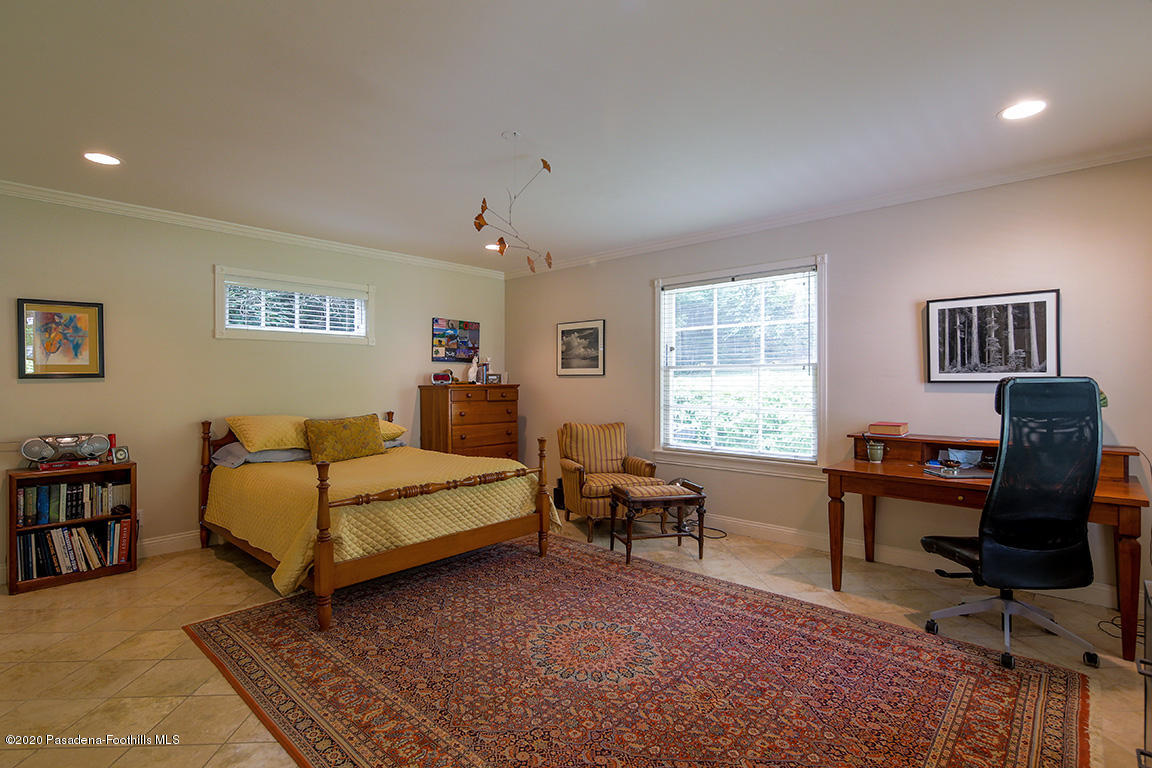 1987 Braeburn Road Altadena, CA 91001 - Photo 21 of 48 a bedroom with a bed wooden floor and a window
