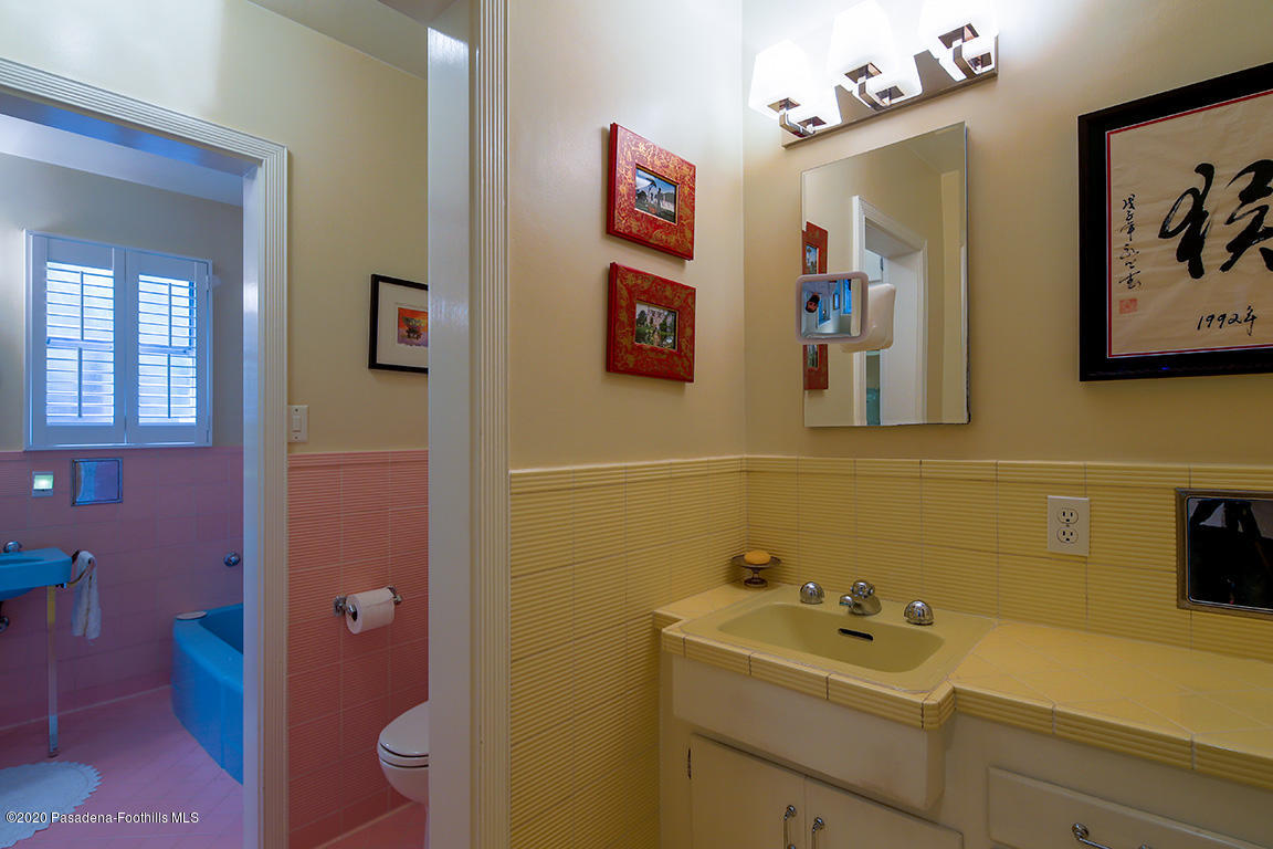 1987 Braeburn Road Altadena, CA 91001 - Photo 24 of 48 a bathroom with a sink mirror and toilet