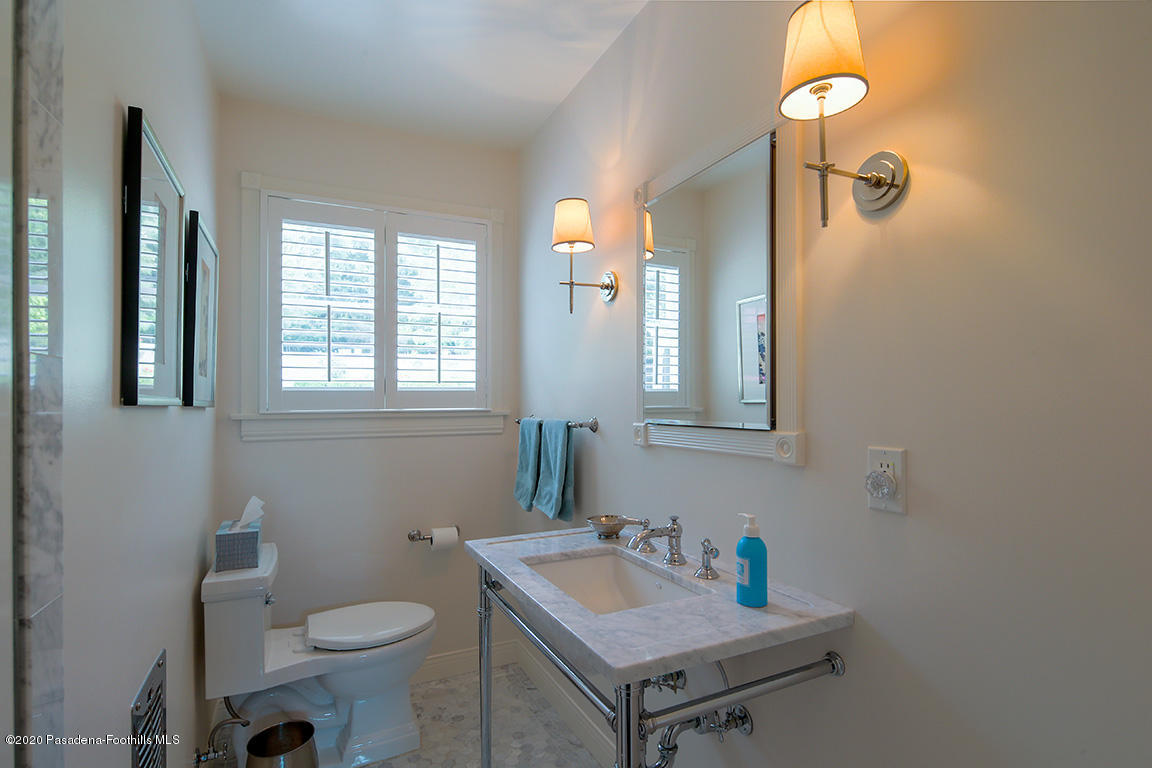 1987 Braeburn Road Altadena, CA 91001 - Photo 26 of 48 a bathroom with a sink toilet and mirror