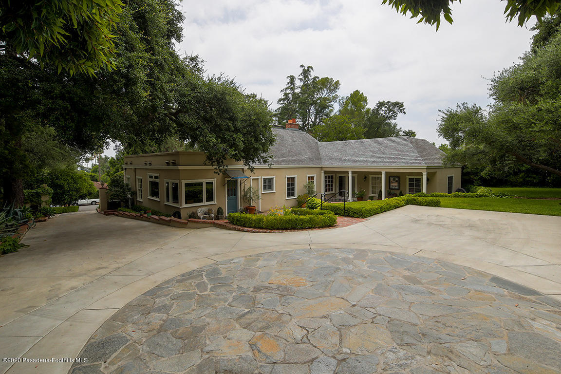 1987 Braeburn Road Altadena, CA 91001 - Photo 30 of 48 a front view of a house with a garden