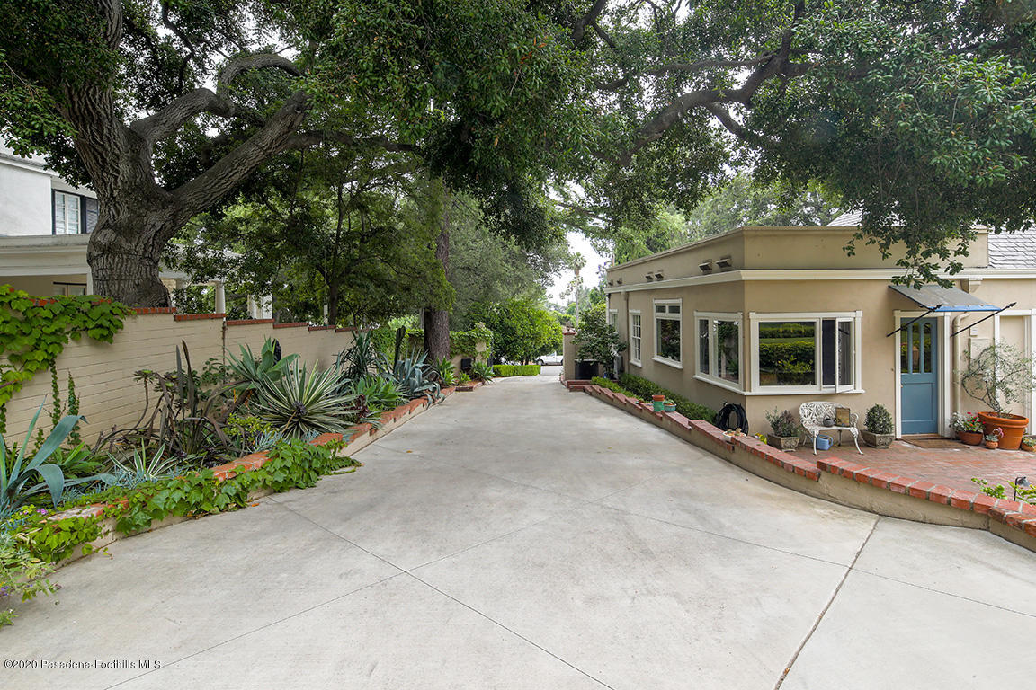 1987 Braeburn Road Altadena, CA 91001 - Photo 45 of 48 a front view of a house with a yard and potted plants