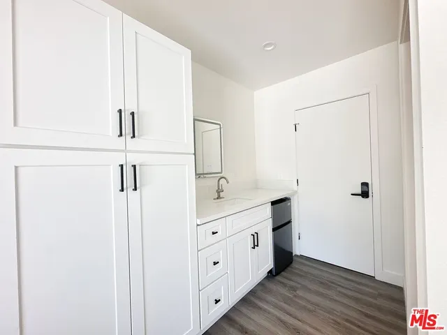 a large bathroom with a double vanity sink and mirror