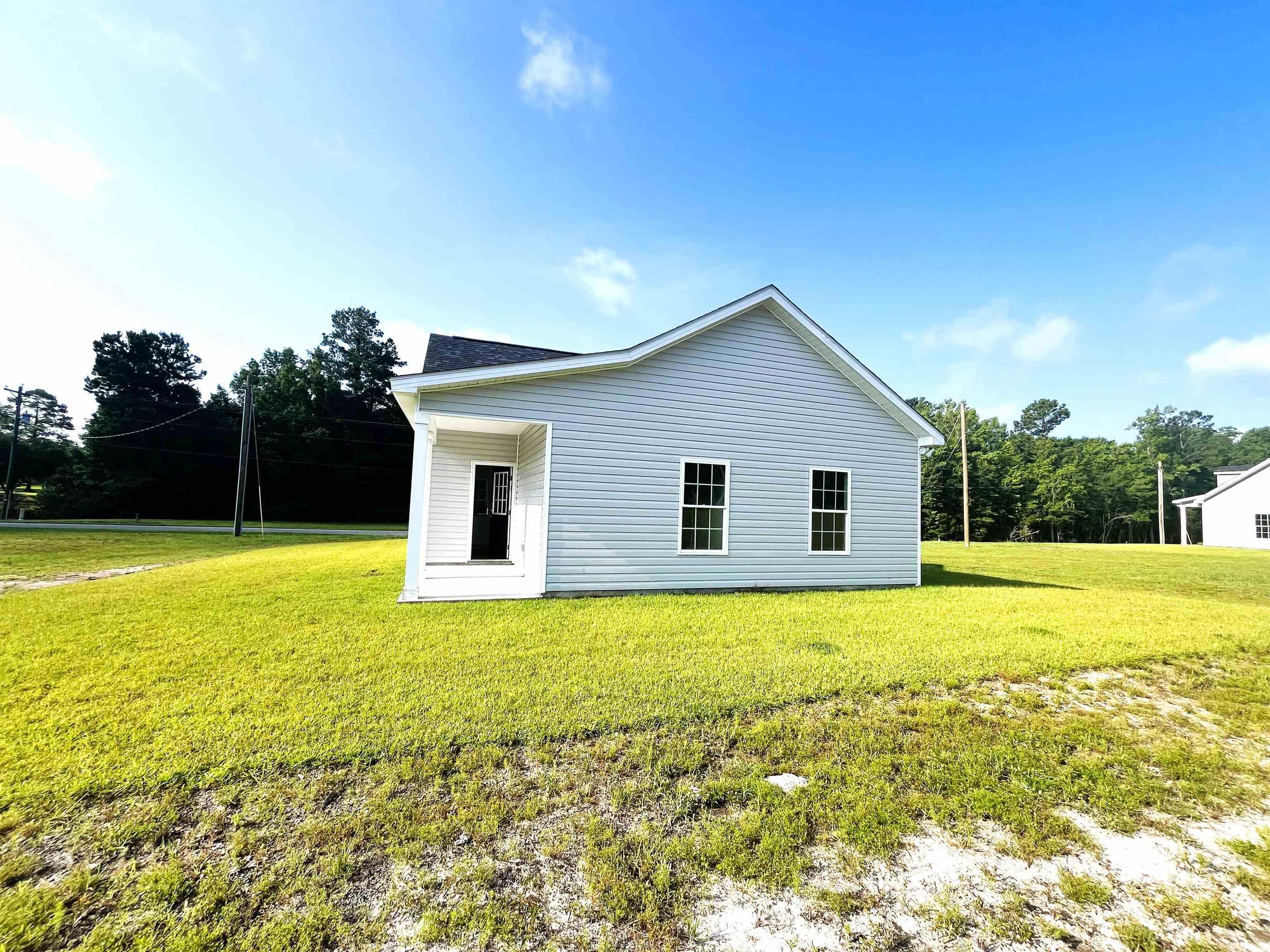 1174 St John Road Galivants Ferry, SC 29544 - Photo 21 of 22 View of home's exterior with a yard