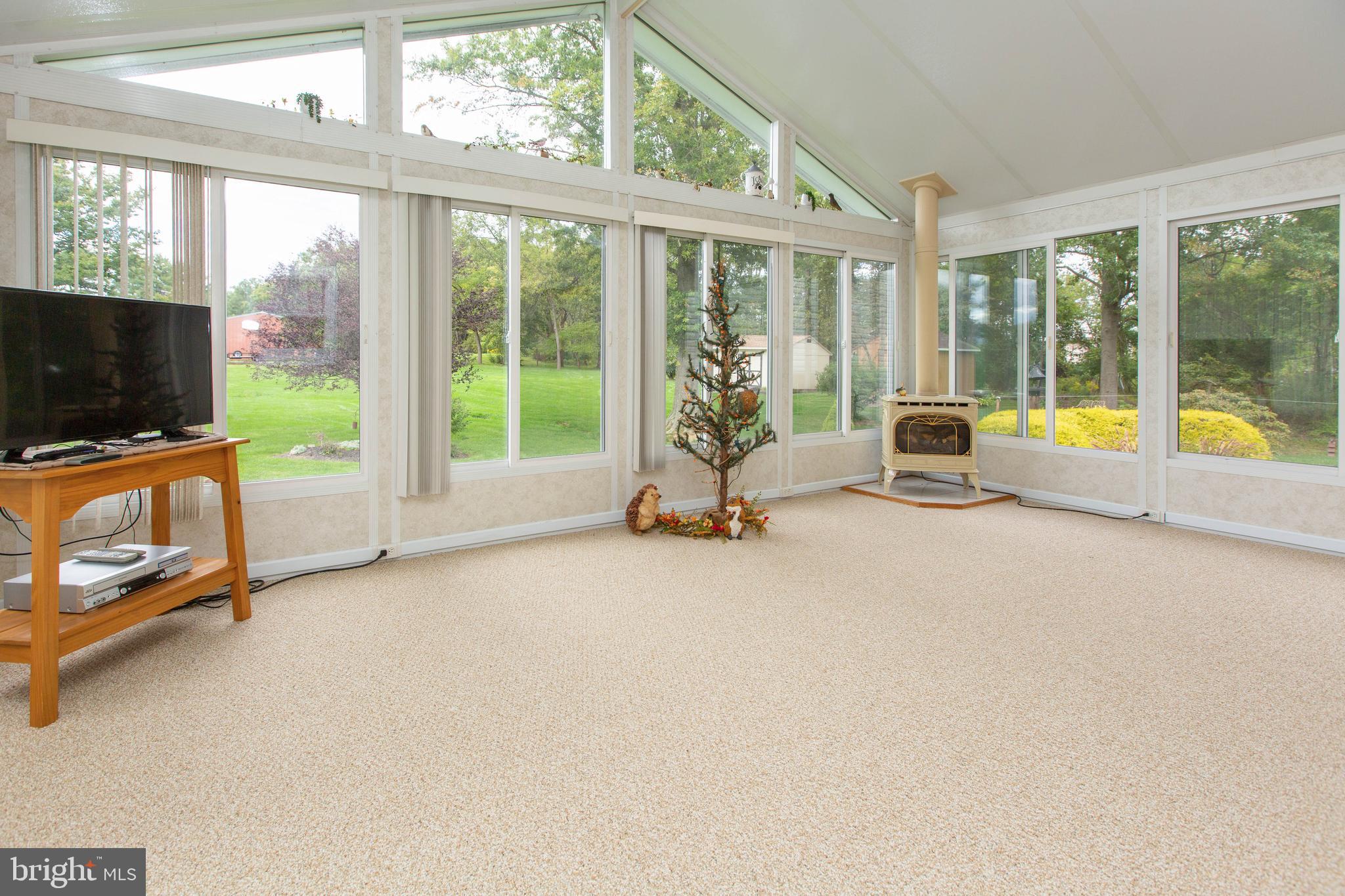 281 Township Line Road East Perkiomenville, PA 18074 - Photo 11 of 41 Sun room with wall of windows