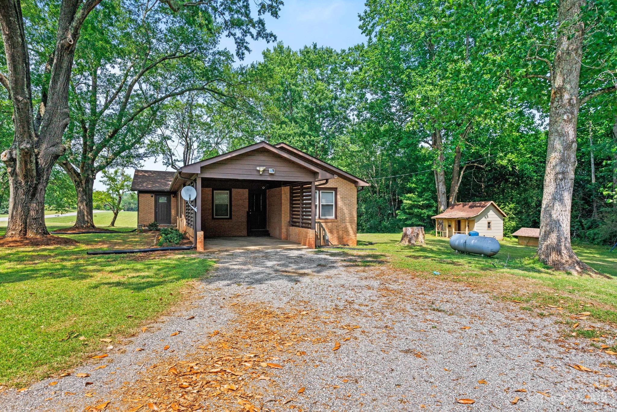 274 McEntire Road Tryon, NC 28782 - Photo 5 of 47 a front view of a house with a yard