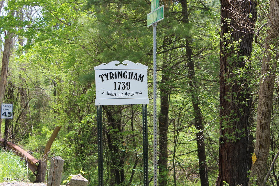 161 Main Road Tyringham, MA 01264 - Photo 2 of 15 a sign that is on a pole