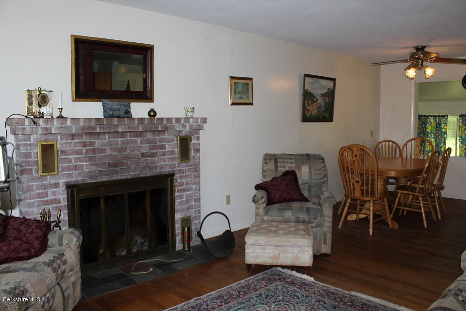 161 Main Road Tyringham, MA 01264 - Photo 6 of 15 a living room with furniture and a fireplace