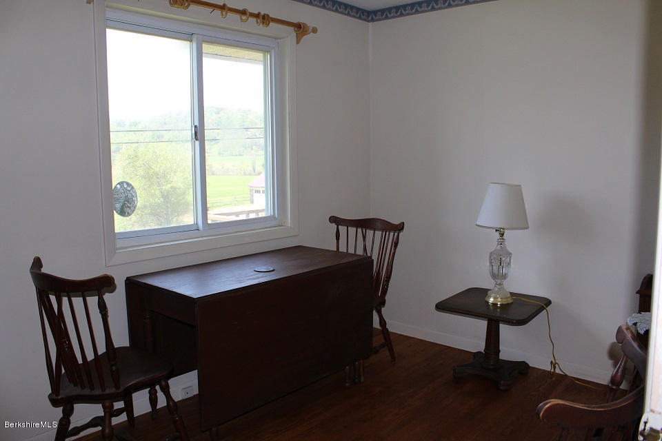 161 Main Road Tyringham, MA 01264 - Photo 8 of 15 a view of a livingroom with chairs and a table