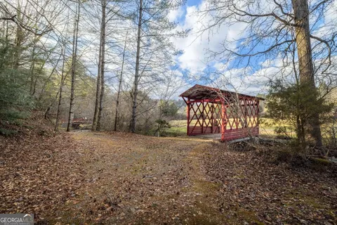 a wooden bench sitting in middle of forest
