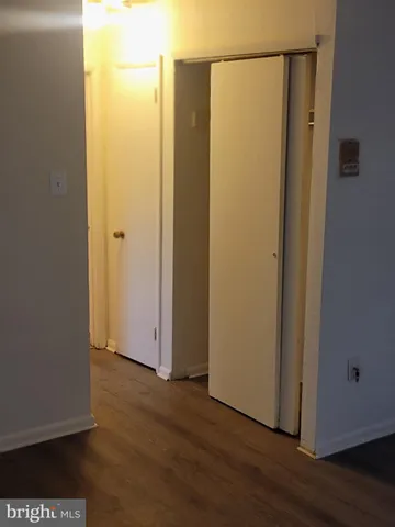 a view of front door with wooden floor