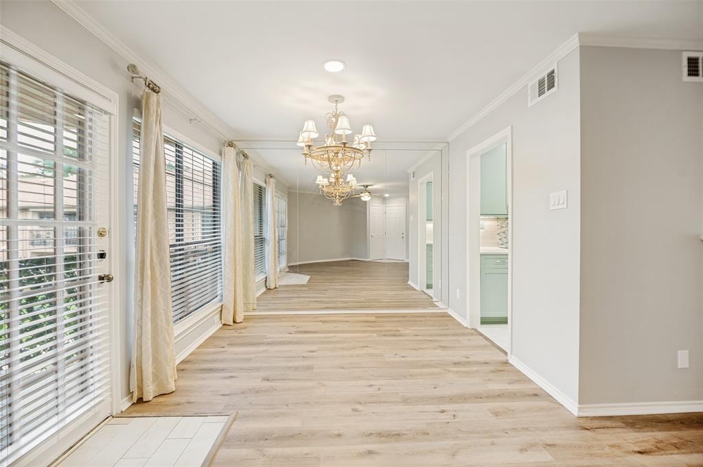 16301 Ledgemont Lane, Unit 263 Addison, TX 75001 - Photo 11 of 25 Outdoor balcony featuring a concrete floor, horizontal siding, and an overhead ceiling fan with lighting