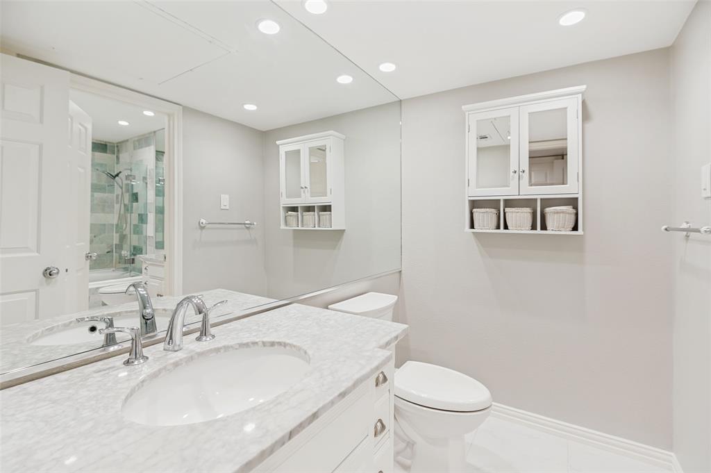 16301 Ledgemont Lane, Unit 263 Addison, TX 75001 - Photo 17 of 25 Room featuring light wood-finish flooring, white baseboards, and a six-panel interior door