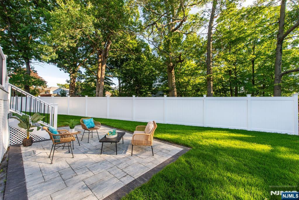 145 Grove Street Mahwah, NJ 07430 - Photo 27 of 30 a view of backyard with seating area and green space