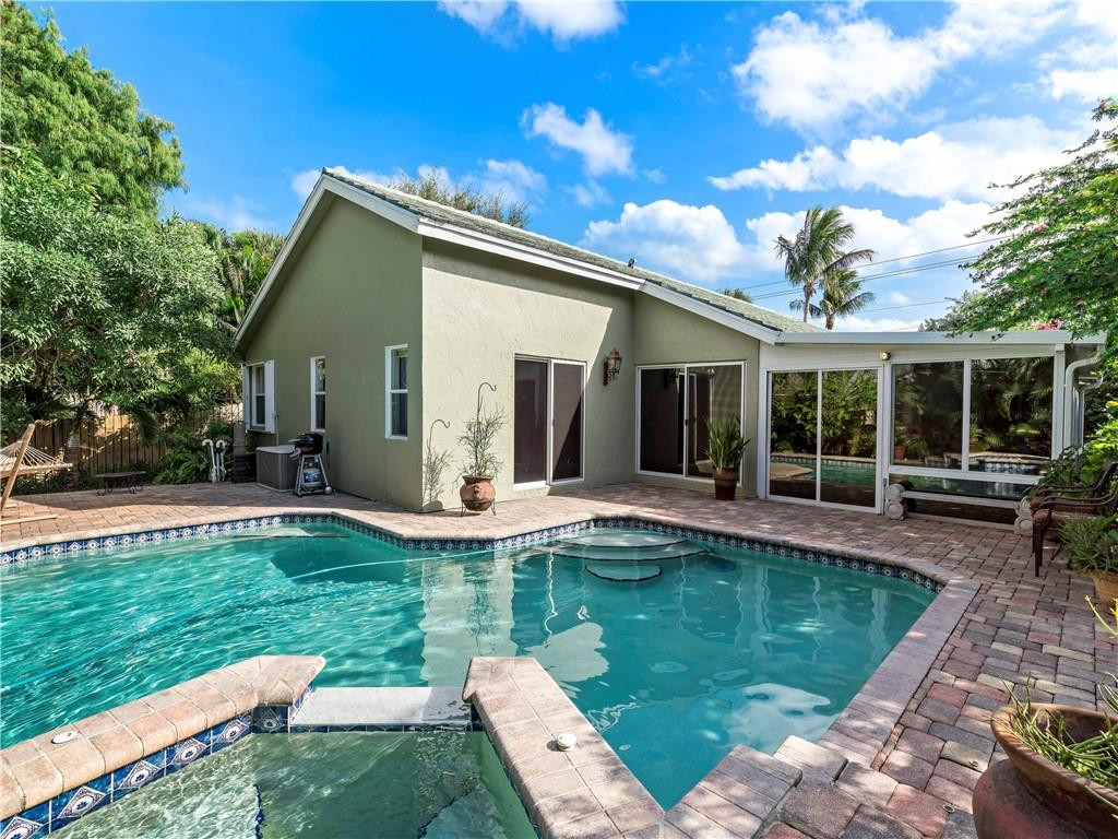1421 Southwest 18th Street Boca Raton, FL 33486 - Photo 26 of 41 a view of a house with backyard and sitting area