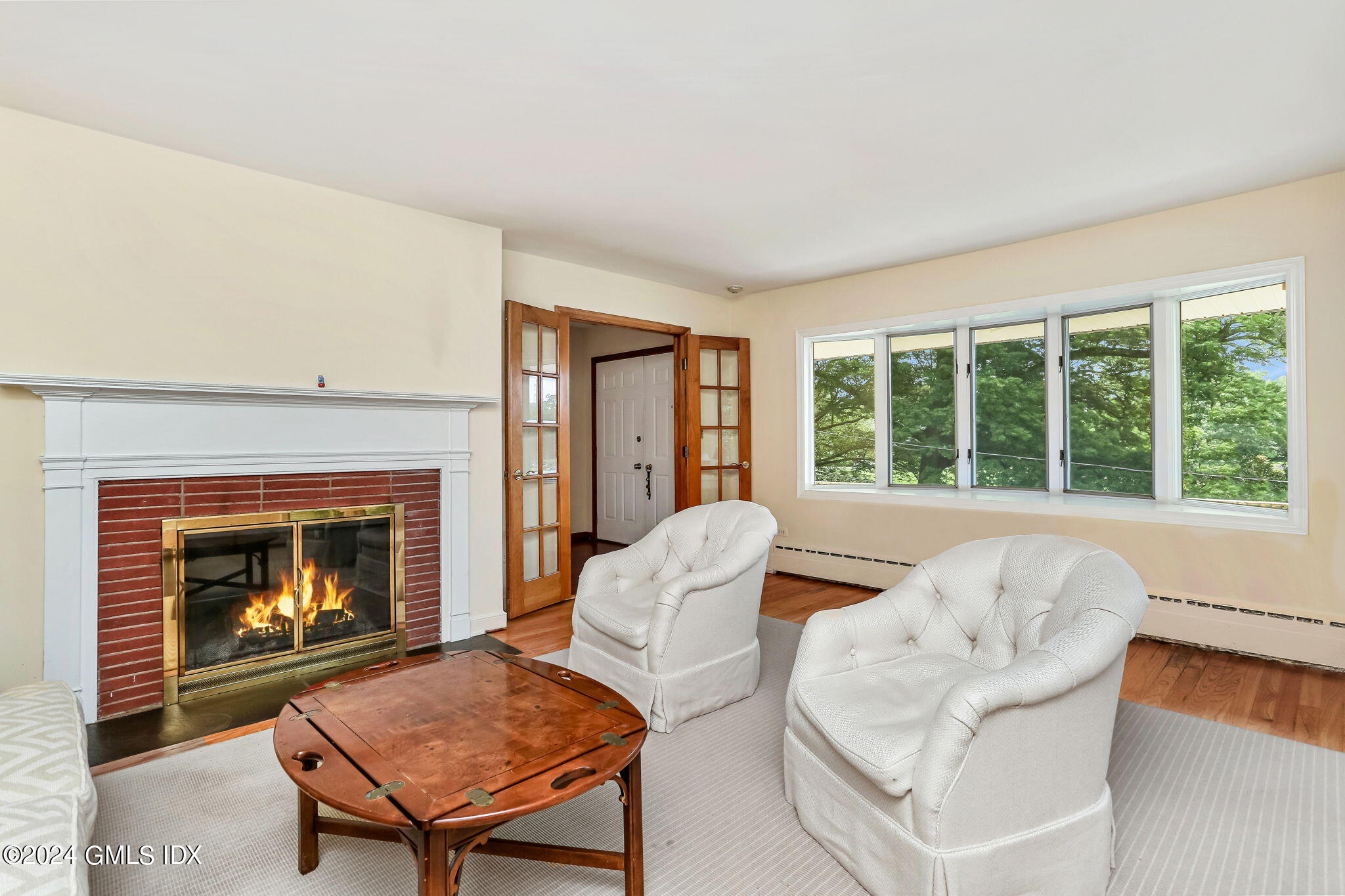 58 Arch Street Riverside, CT 06878 - Photo 2 of 21 a living room with furniture and a fireplace