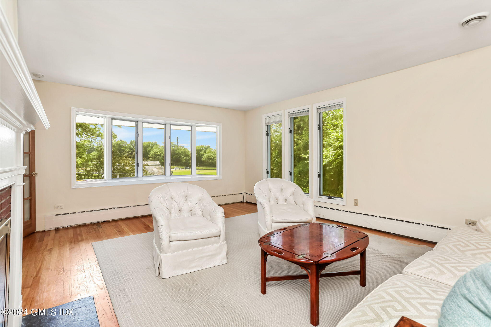 58 Arch Street Riverside, CT 06878 - Photo 3 of 21 a living room with furniture and a large window