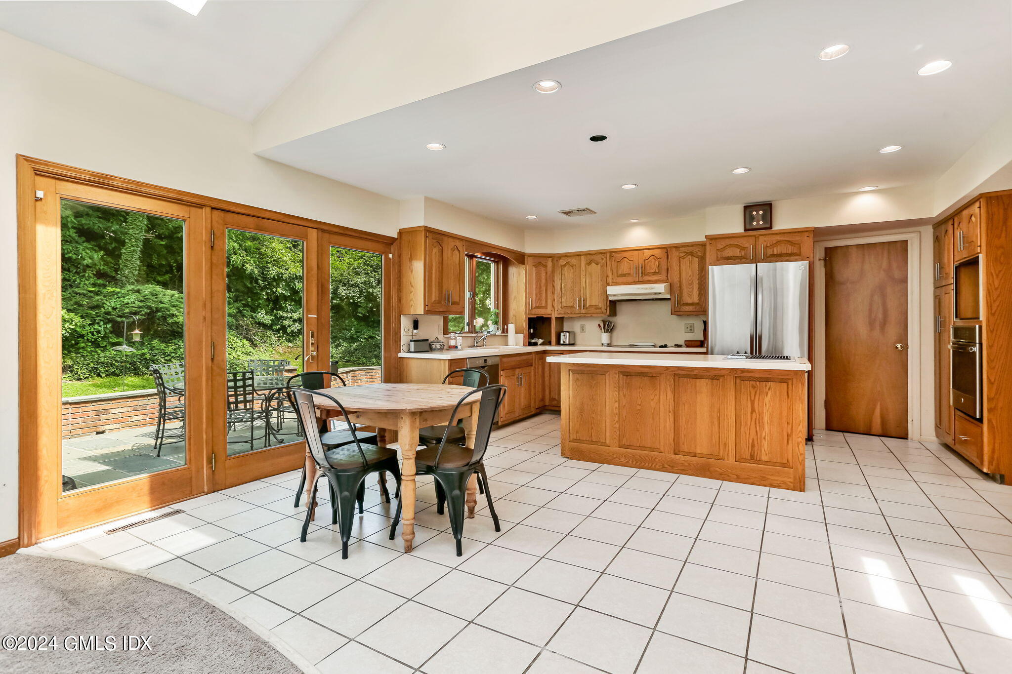 58 Arch Street Riverside, CT 06878 - Photo 4 of 21 a kitchen with stainless steel appliances granite countertop a stove a sink and a refrigerator