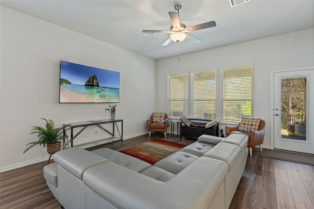 9517 Sunset Lane Oak Point, TX 75068 - Photo 11 of 40 a living room with furniture and a large window