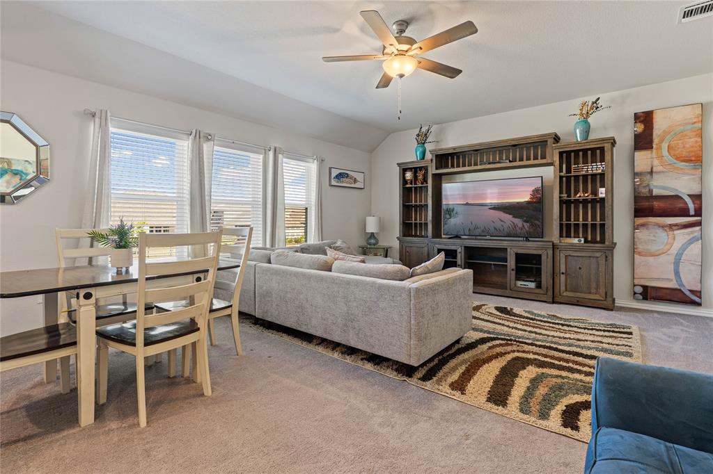 9517 Sunset Lane Oak Point, TX 75068 - Photo 25 of 40 a living room with furniture and a flat screen tv