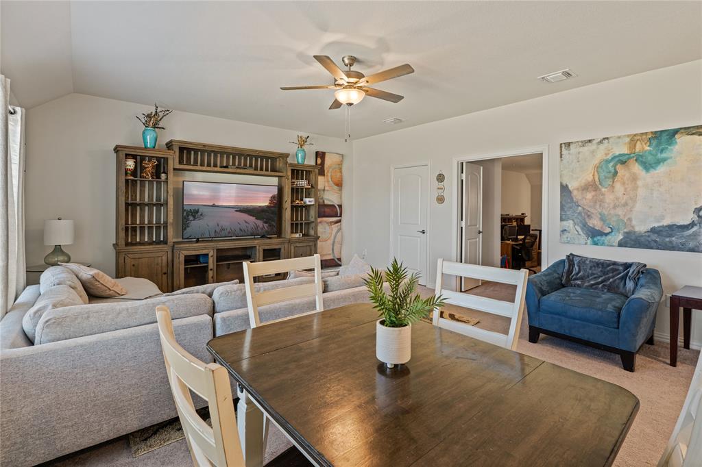 9517 Sunset Lane Oak Point, TX 75068 - Photo 26 of 40 a living room with furniture and a flat screen tv