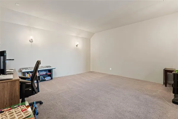 a view of a workspace with furniture