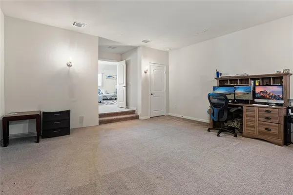 a view of a hallway with kitchen view