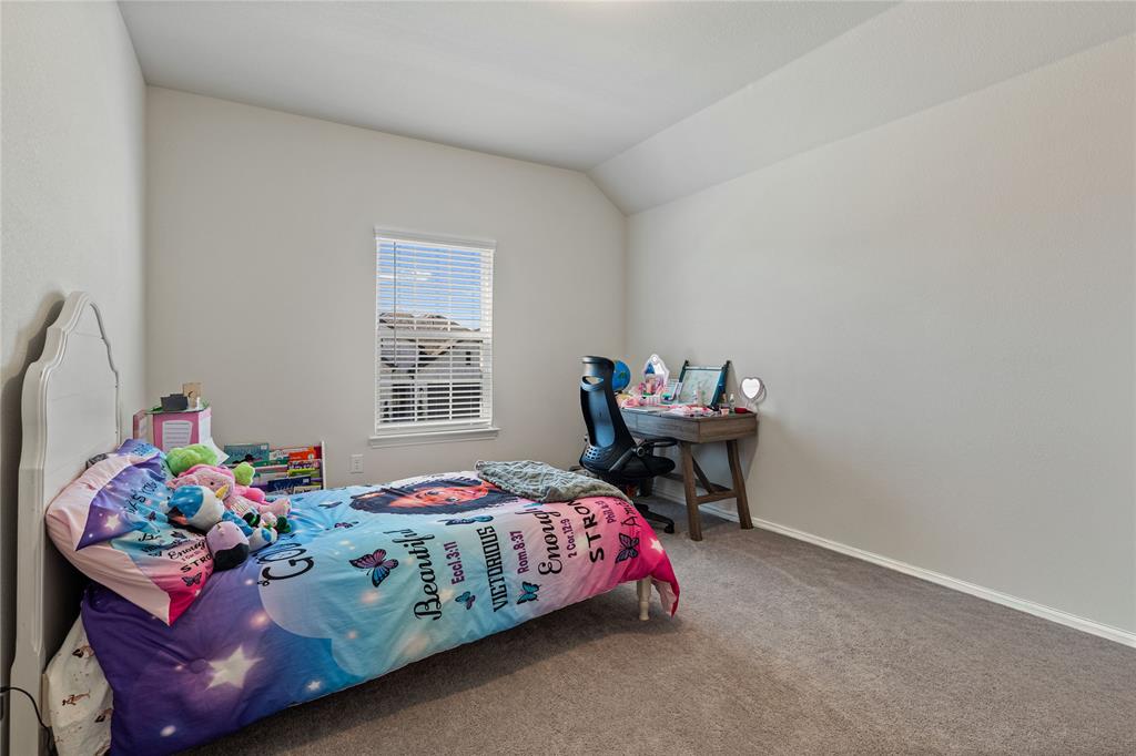 9517 Sunset Lane Oak Point, TX 75068 - Photo 31 of 40 a bedroom with a bed table chair and a window