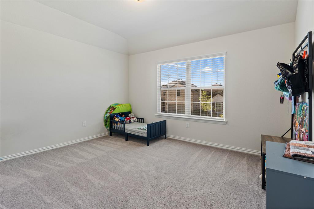 9517 Sunset Lane Oak Point, TX 75068 - Photo 32 of 40 9517 Sunset Lane, Oak Point, TX 75068 - bedroo - Bedroom featuring light colored carpet