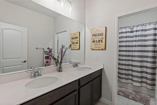 a view of a patio with a table and chairs