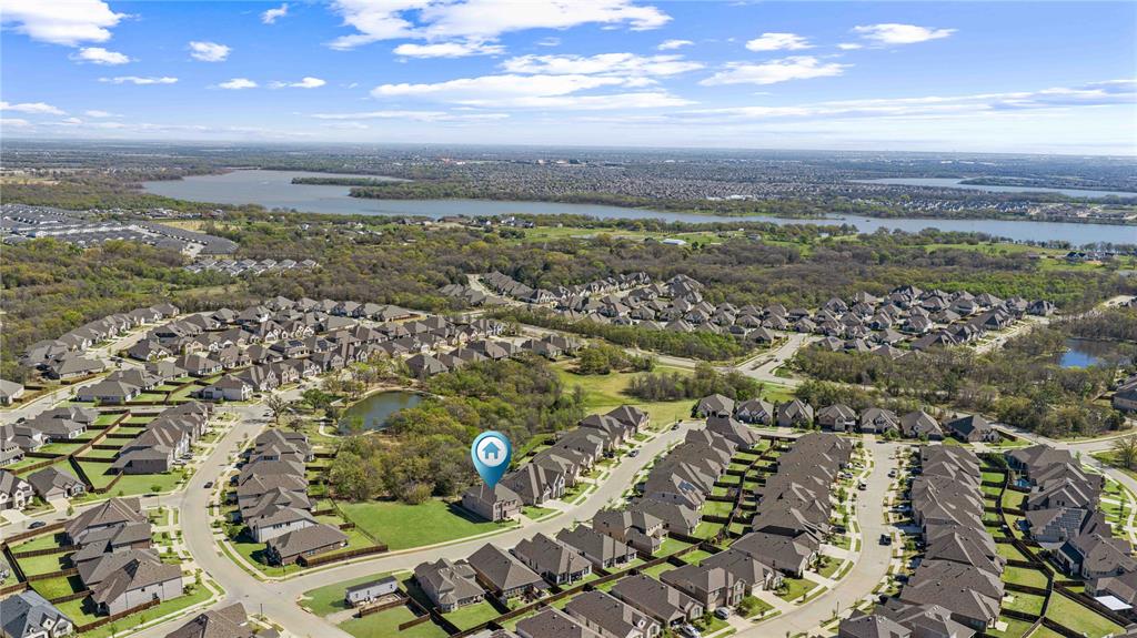 9517 Sunset Lane Oak Point, TX 75068 - Photo 40 of 40 9517 Sunset Lane, Oak Point, TX 75068 - aerial - Aerial perspective of suburban area with a nearby body of water