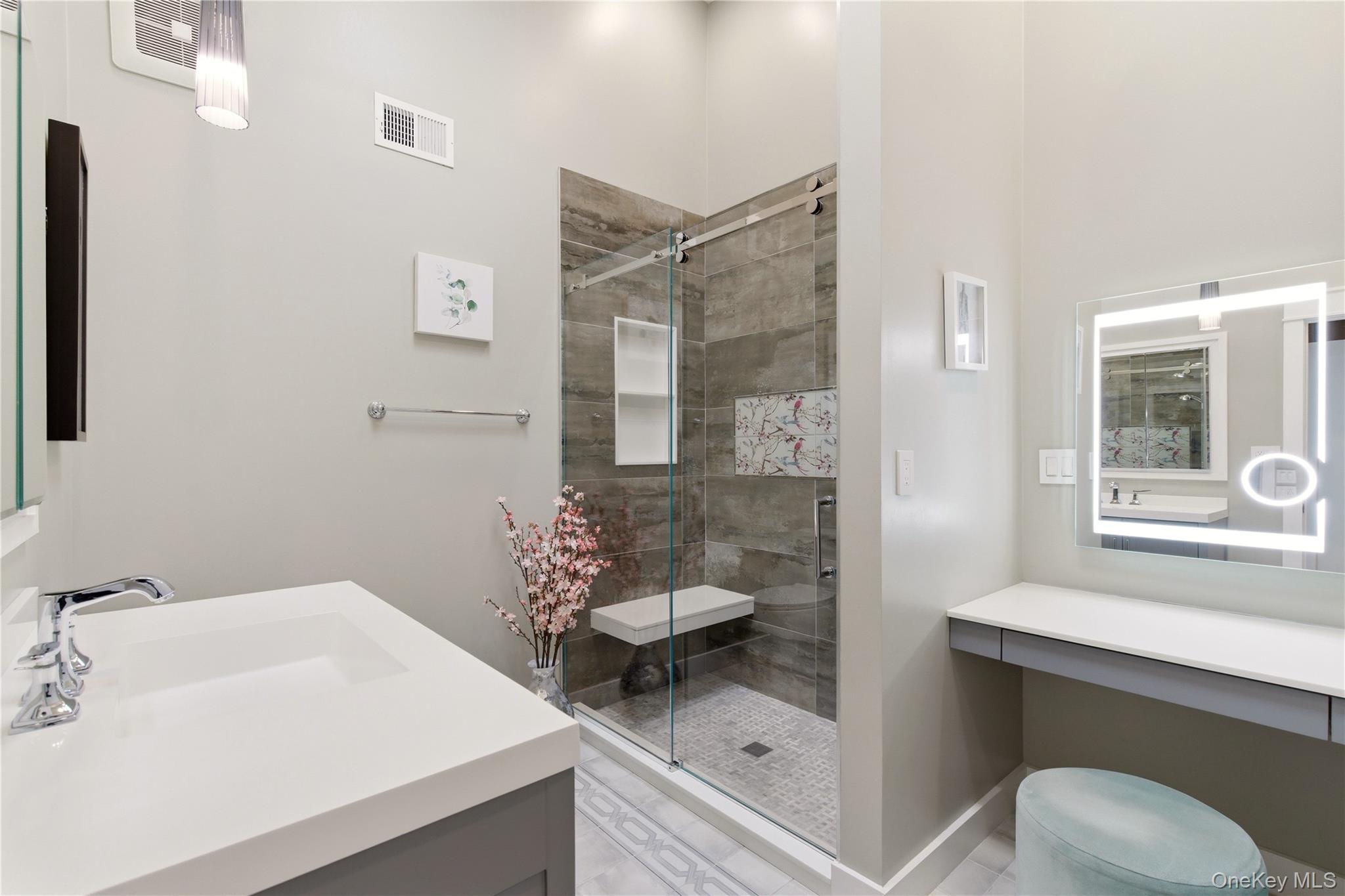 44 Hidden Ridge Drive Syosset, NY 11791 - Photo 12 of 28 a bathroom with a sink toilet and shower