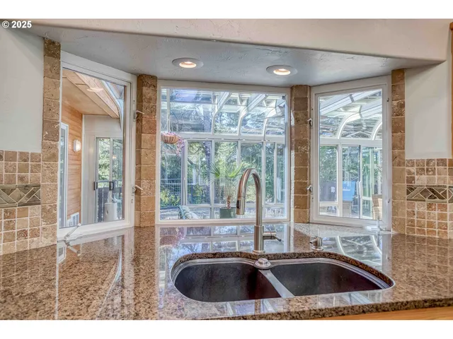 a bathroom with sink and mirror