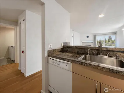 a kitchen with a sink and a refrigerator