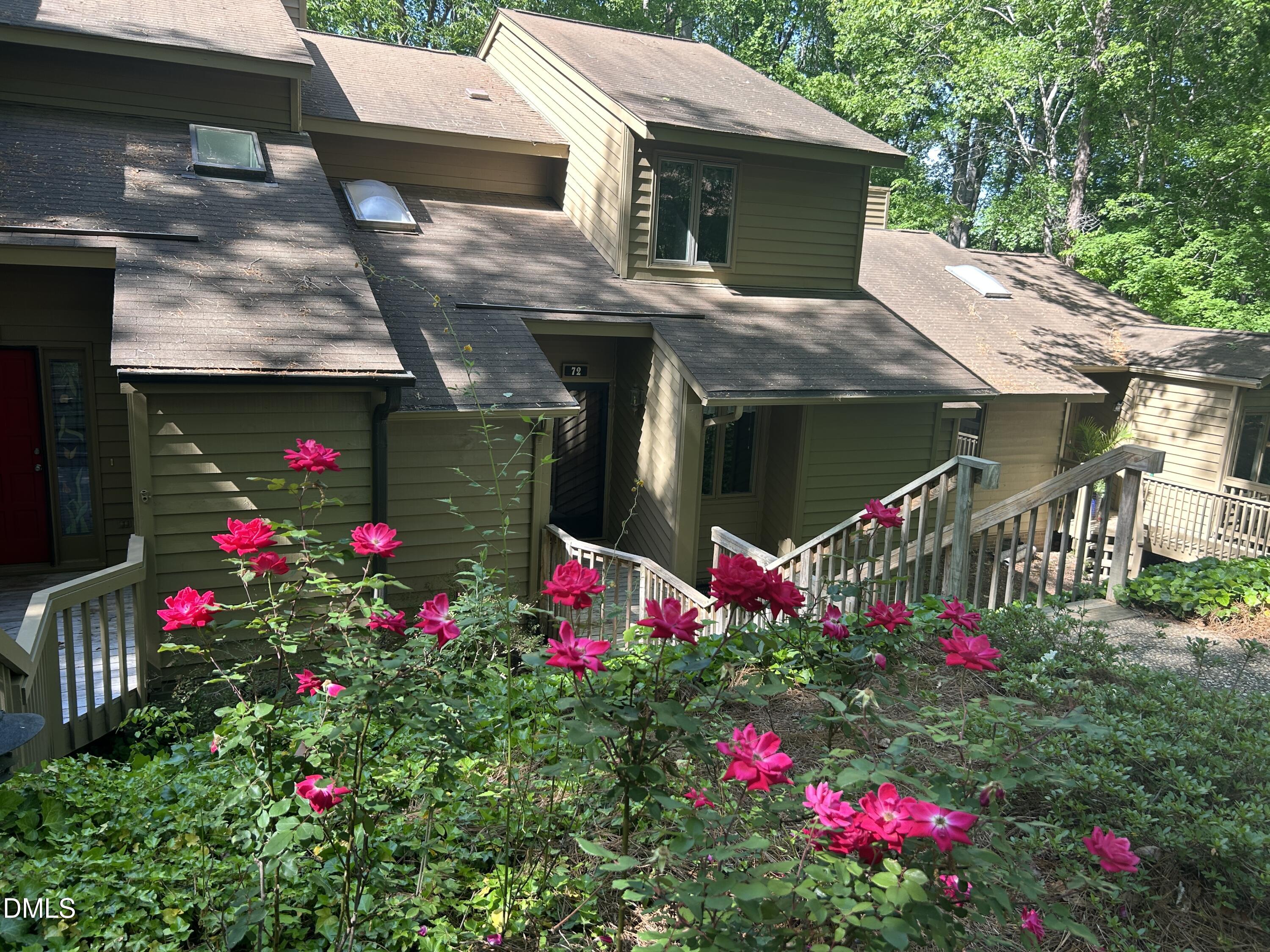 72 Stoneridge Road Durham, NC 27705 - Photo 1 of 28 a view of a house with a lot of flower plants
