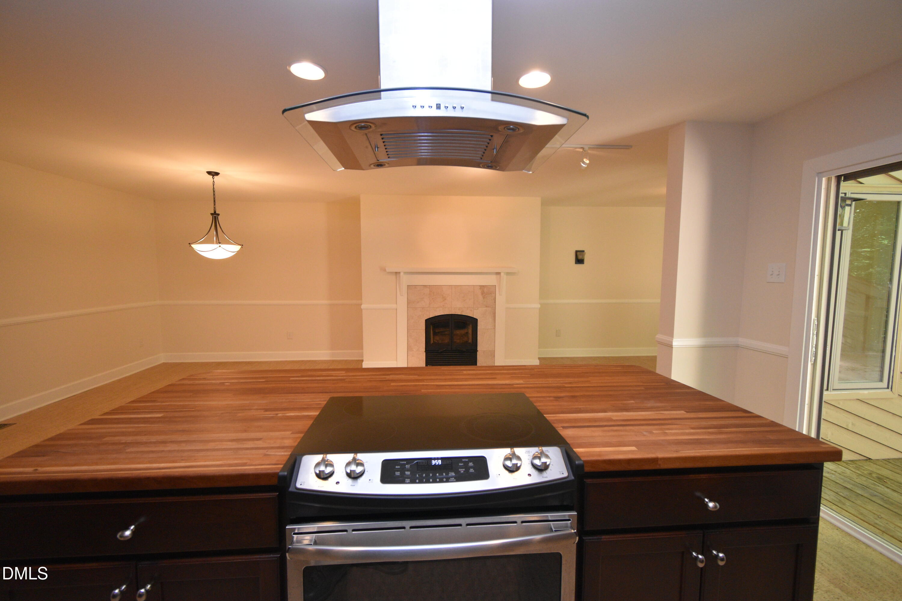 72 Stoneridge Road Durham, NC 27705 - Photo 12 of 28 a kitchen with a stove and a wooden floor