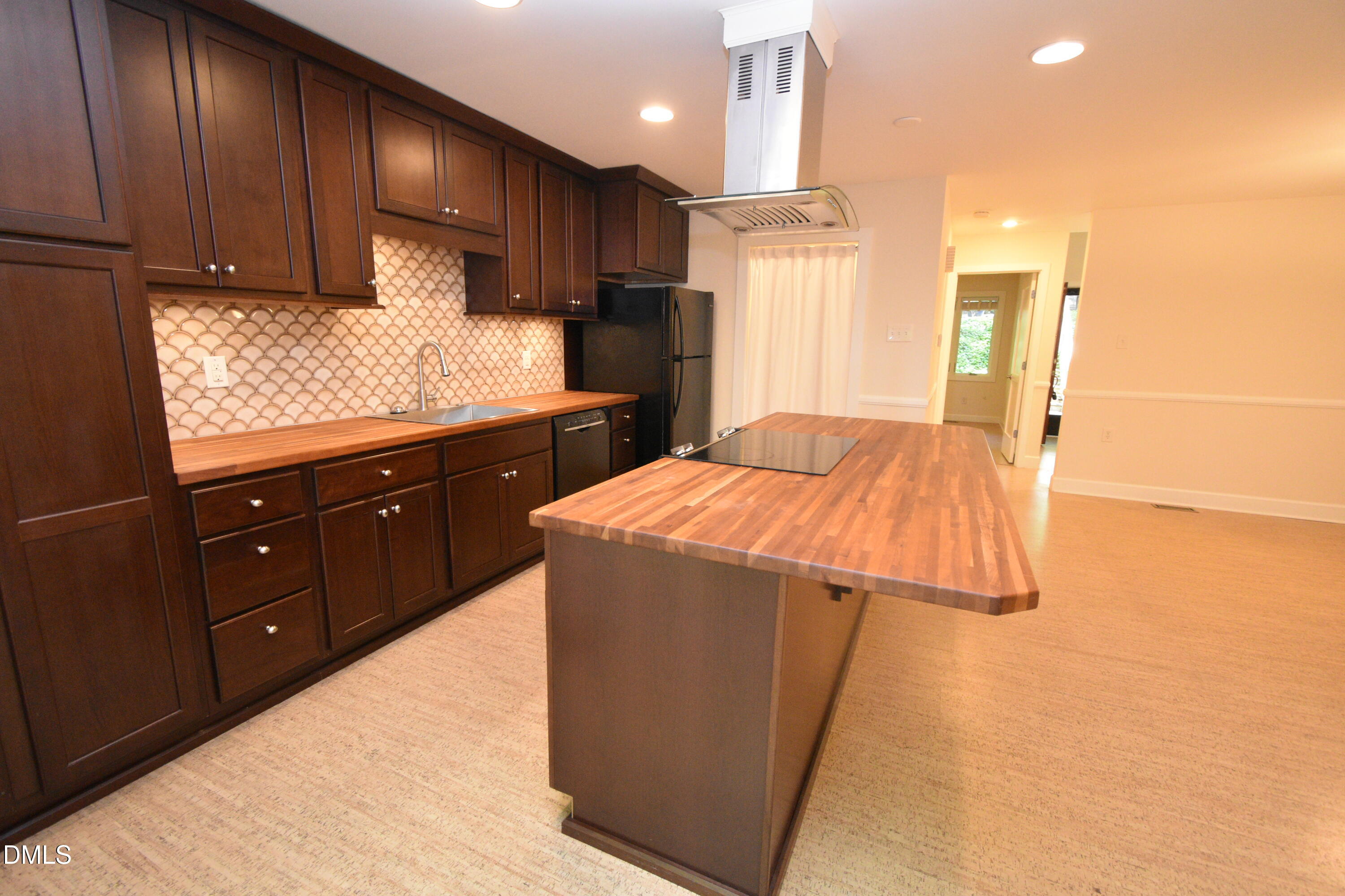 72 Stoneridge Road Durham, NC 27705 - Photo 14 of 28 a kitchen with stainless steel appliances kitchen island granite countertop wooden cabinets and sink