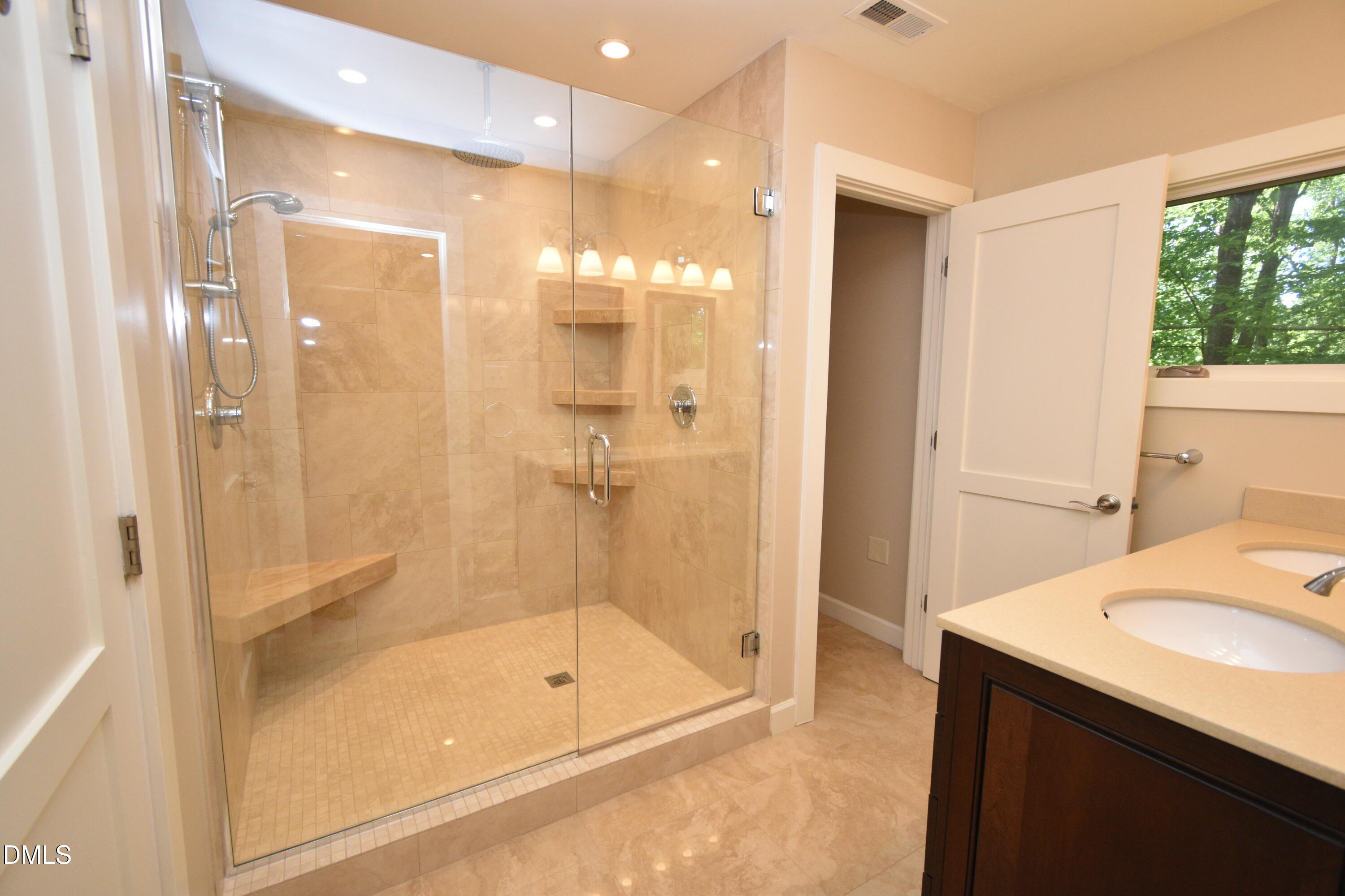 72 Stoneridge Road Durham, NC 27705 - Photo 21 of 28 a bathroom with a shower and a sink