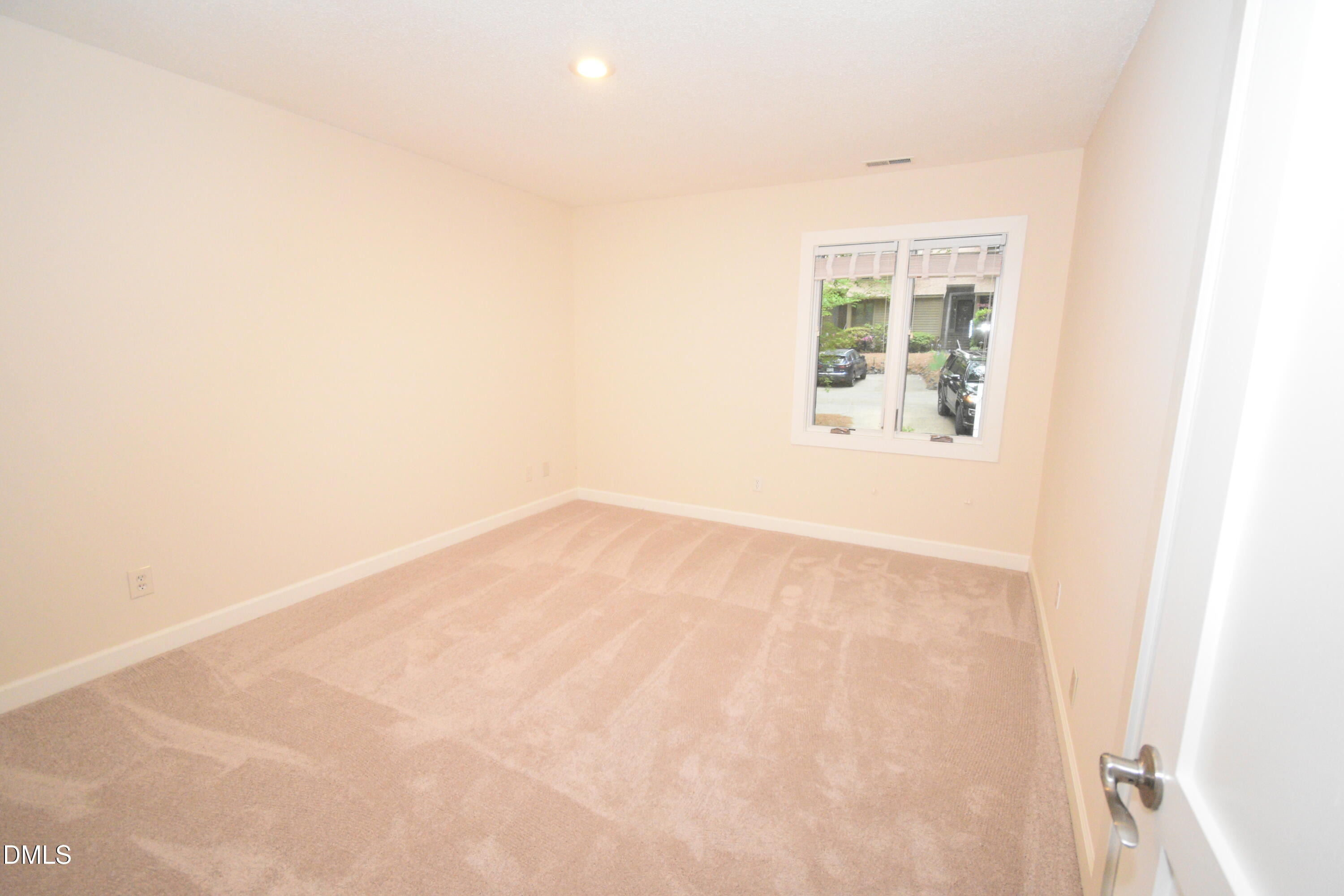 72 Stoneridge Road Durham, NC 27705 - Photo 25 of 28 an empty room with a window
