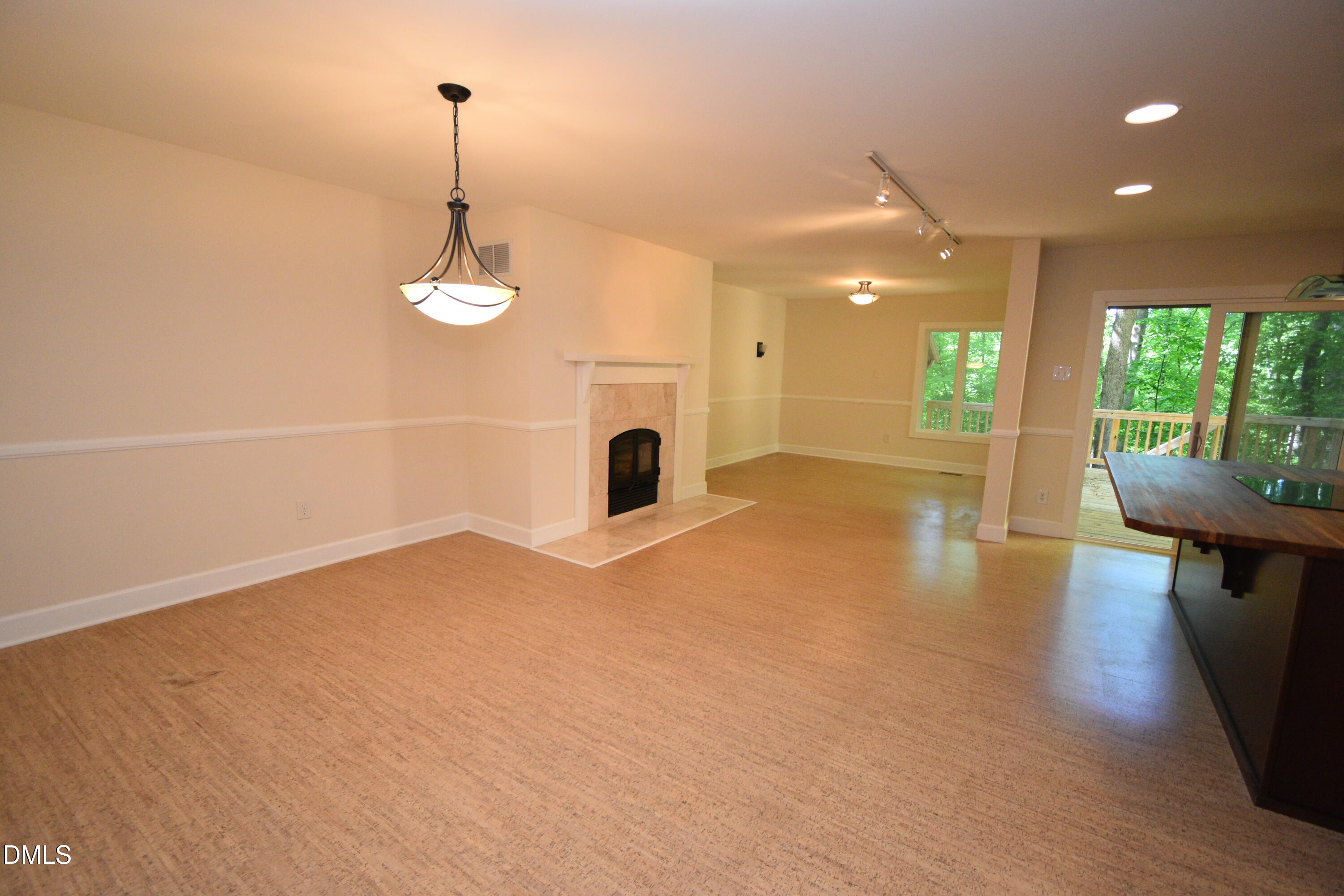 72 Stoneridge Road Durham, NC 27705 - Photo 5 of 28 a view of a livingroom with a chandelier wooden floor and a chandelier