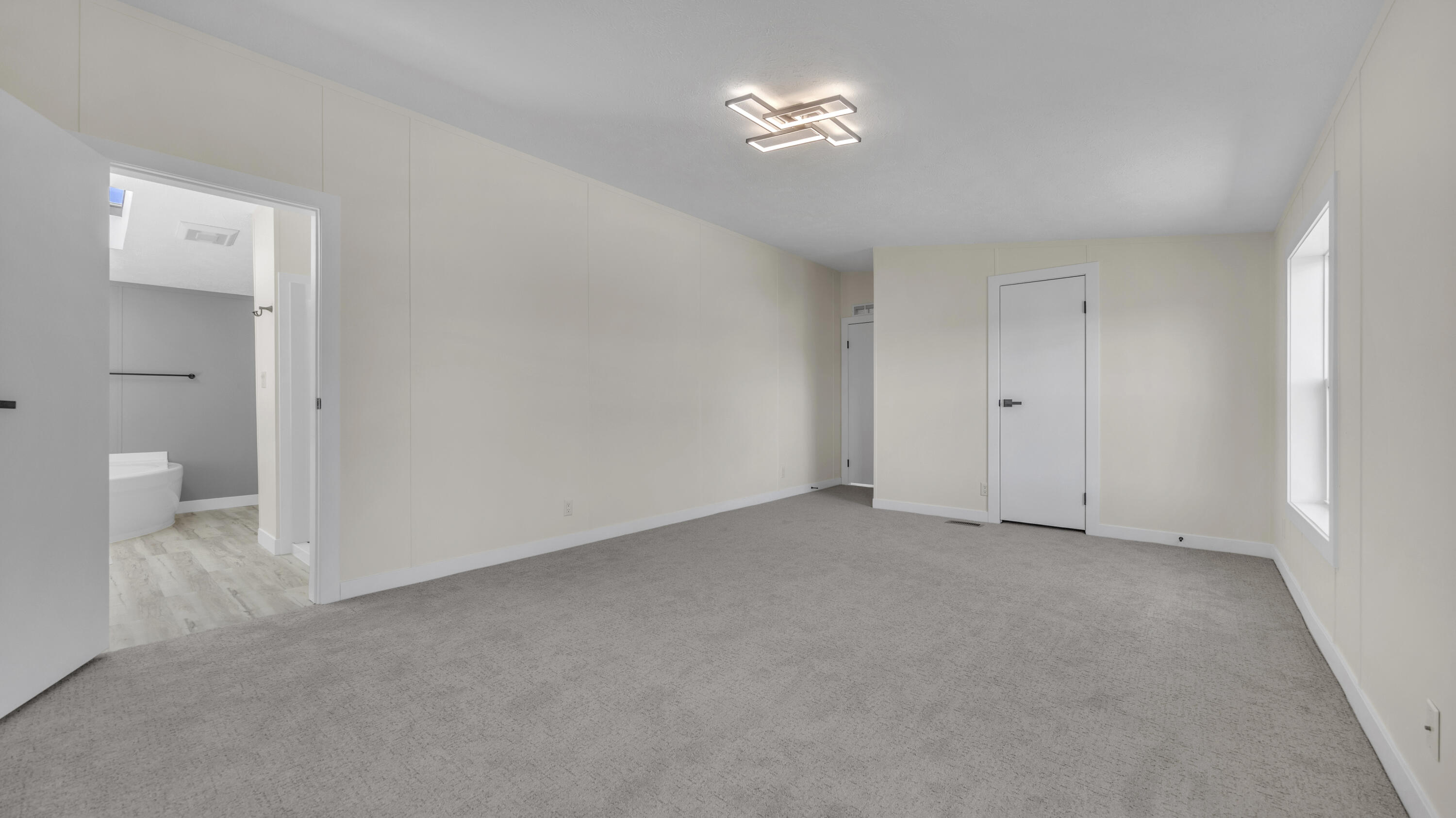 5019 Flagstone Road Sheboygan, WI 53083 - Photo 17 of 48 PRIMARY BEDROOM TO PRIMARY ENSUITE