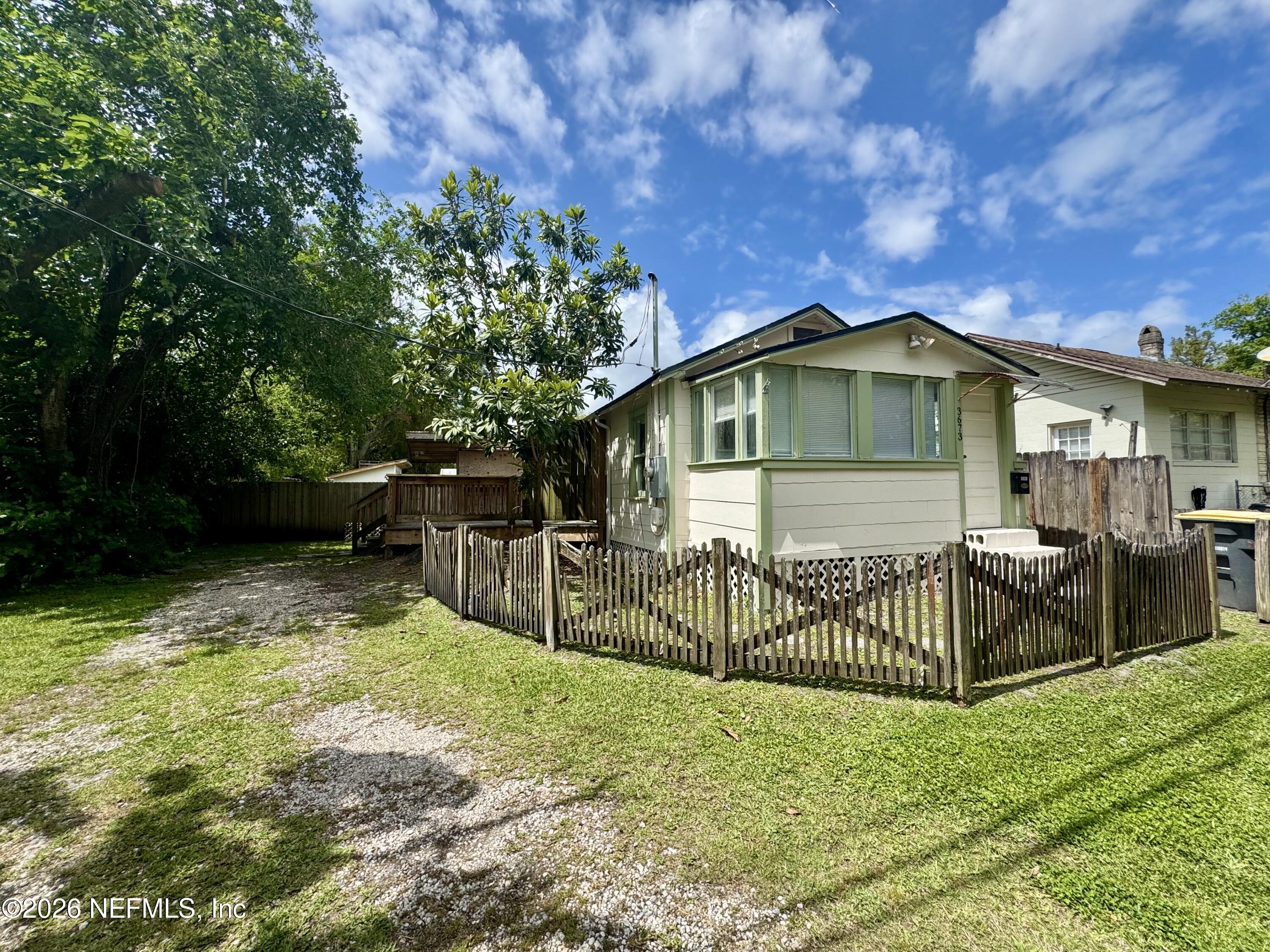 3673 Randall Street Jacksonville, FL 32205 - Photo 1 of 9 a view of a house with a yard