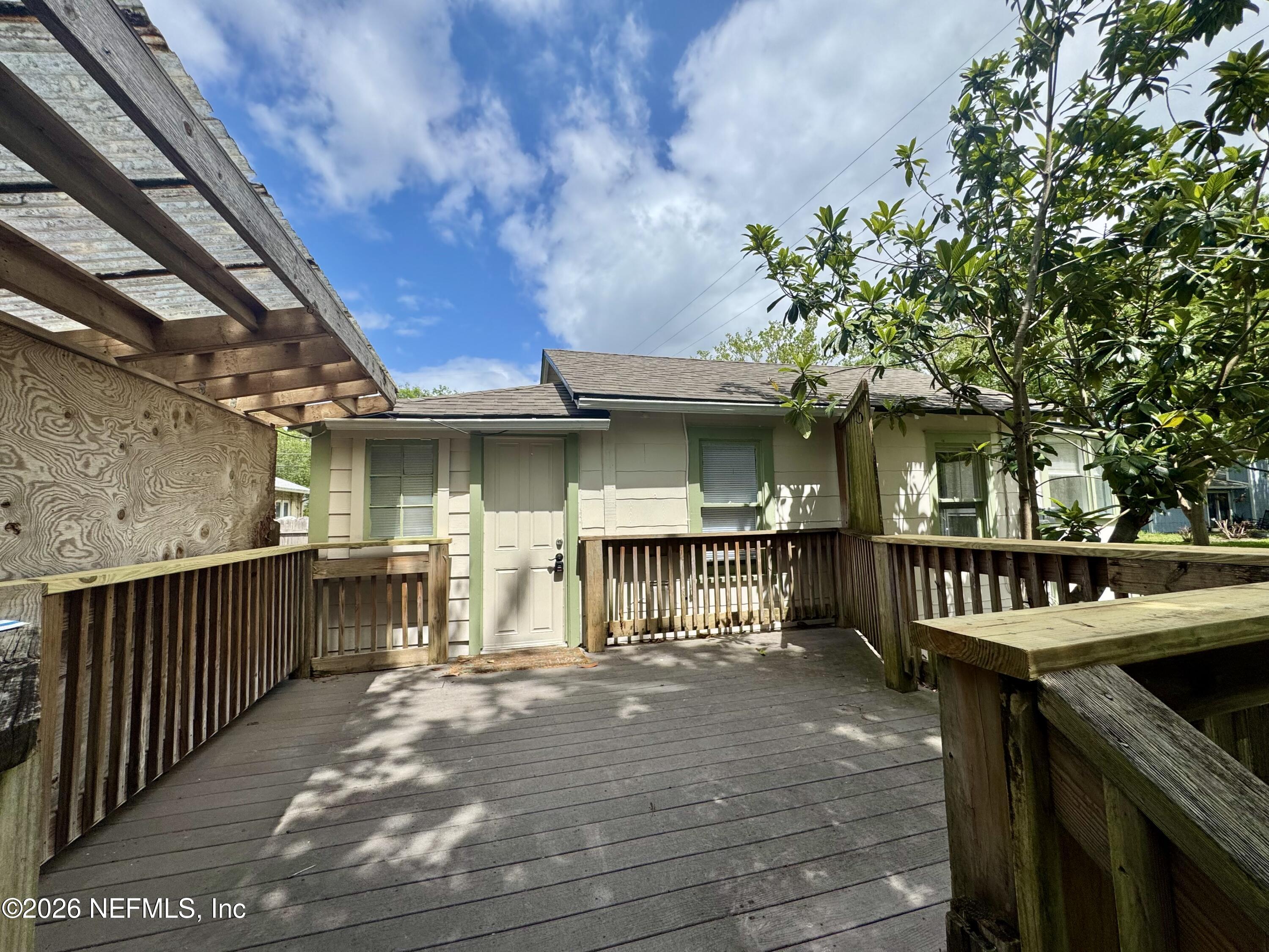 3673 Randall Street Jacksonville, FL 32205 - Photo 2 of 9 a view of a patio with a table and chairs