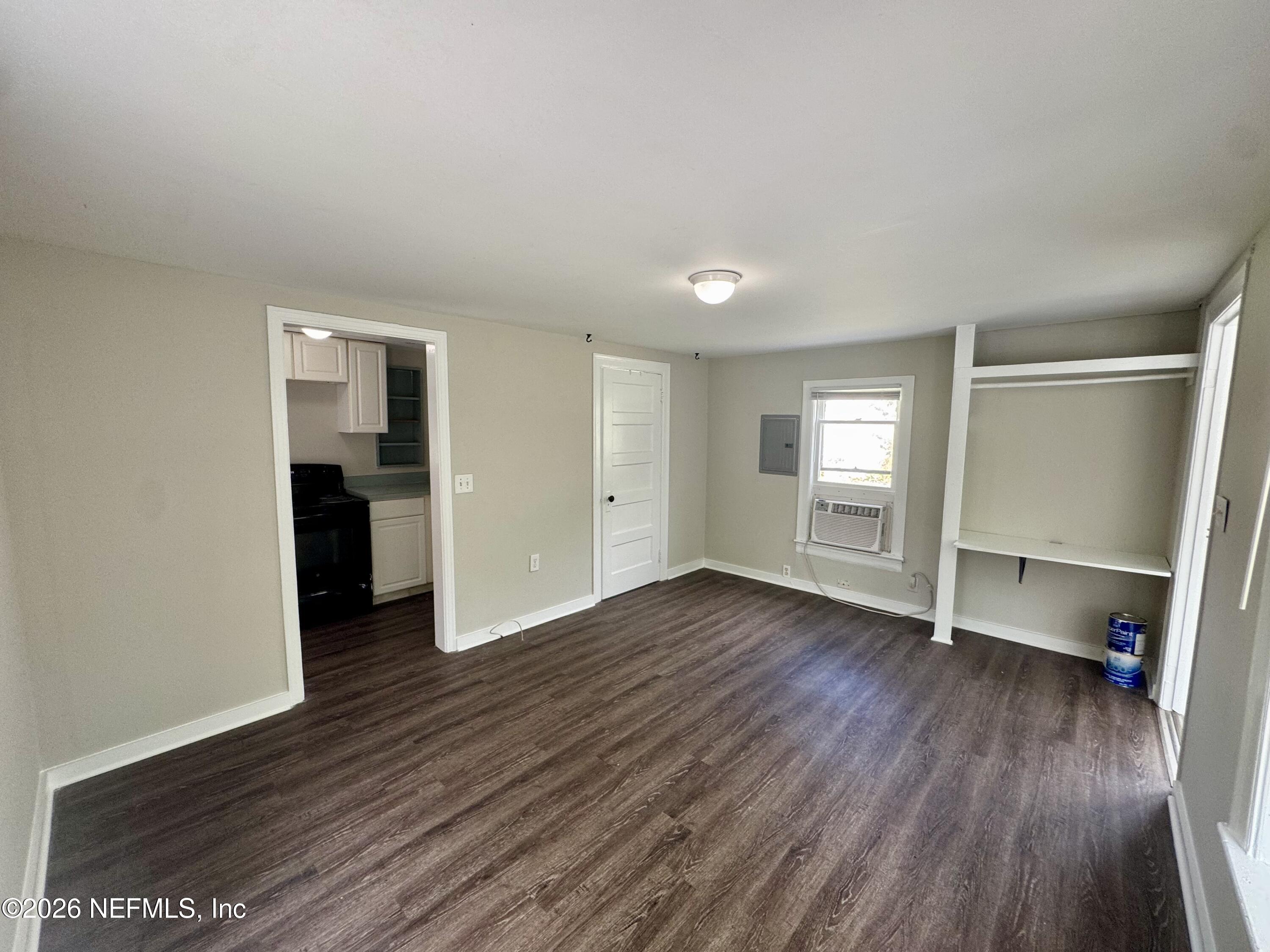 3673 Randall Street Jacksonville, FL 32205 - Photo 5 of 9 an empty room with wooden floor and closet