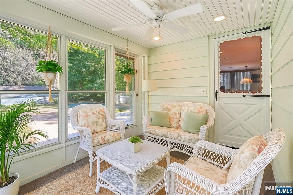 14 Valhalla Way Wayne, NJ 07470 - Photo 12 of 32 a living room with furniture and a floor to ceiling window