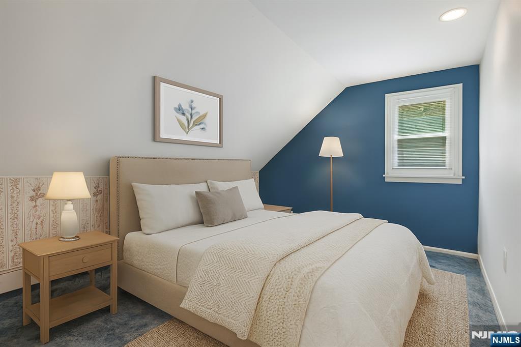 14 Valhalla Way Wayne, NJ 07470 - Photo 18 of 32 a bedroom with a bed and a lamp