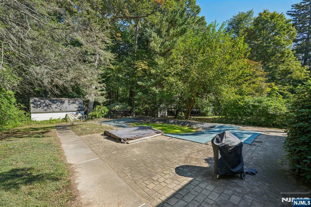 14 Valhalla Way Wayne, NJ 07470 - Photo 27 of 32 a view of a backyard with swimming pool