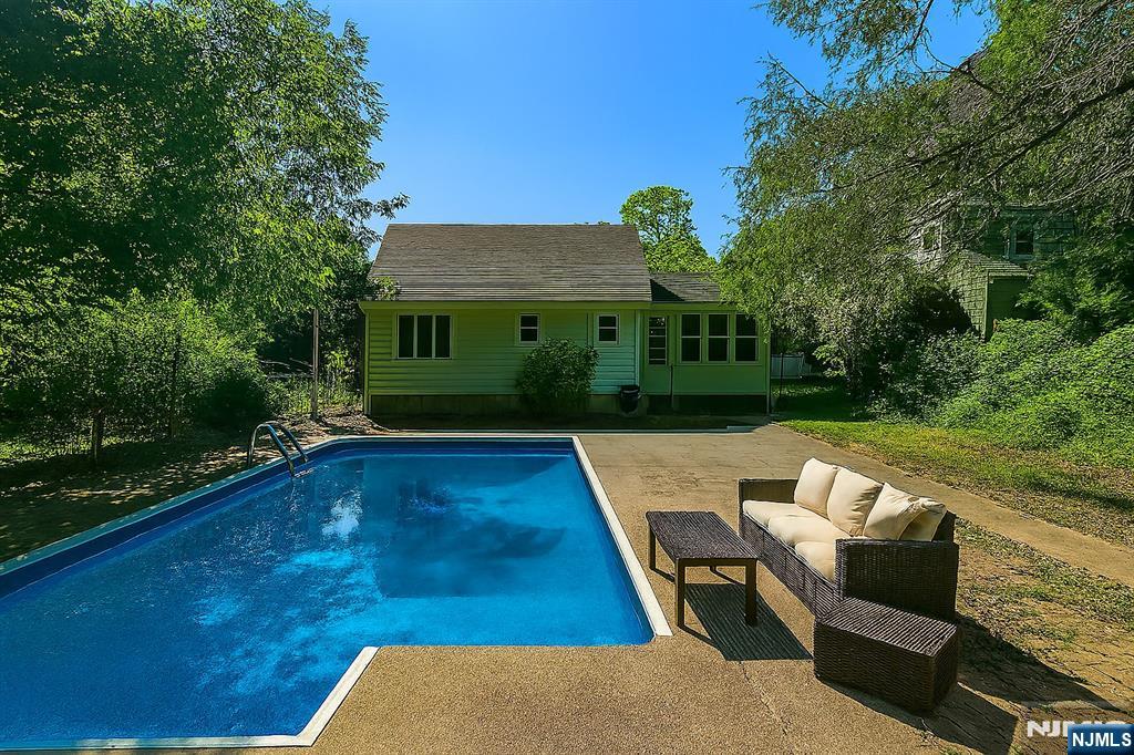 14 Valhalla Way Wayne, NJ 07470 - Photo 28 of 32 a view of backyard with swimming pool and outdoor seating