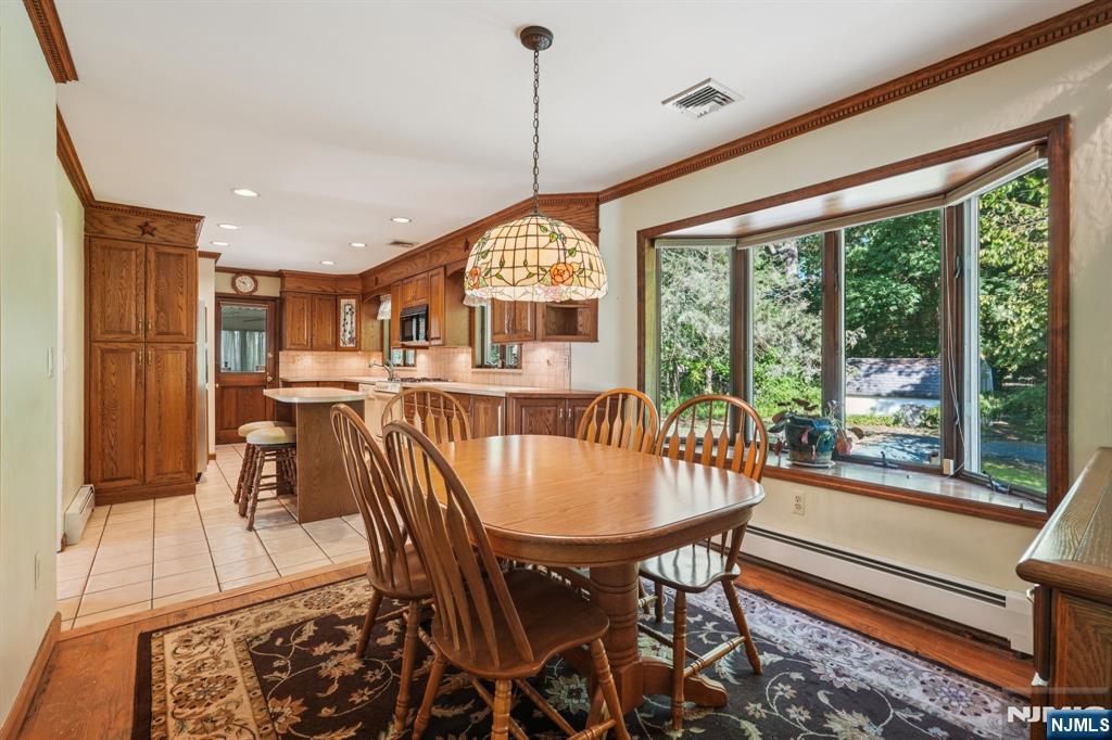 14 Valhalla Way Wayne, NJ 07470 - Photo 7 of 32 a dining room with furniture window and wooden floor