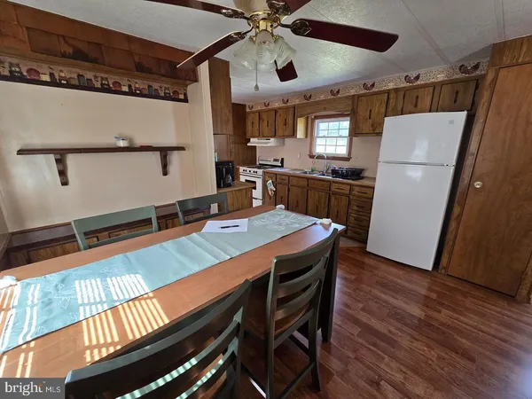 a room with wooden floor and furniture